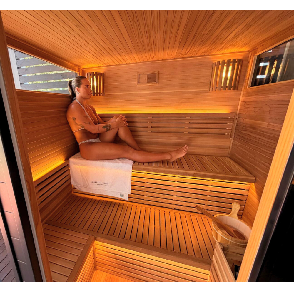 Woman sitting in Traditional sauna